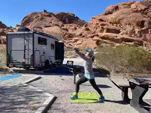 woman exercising near RV