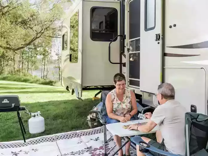 couple relaxing outside trailer