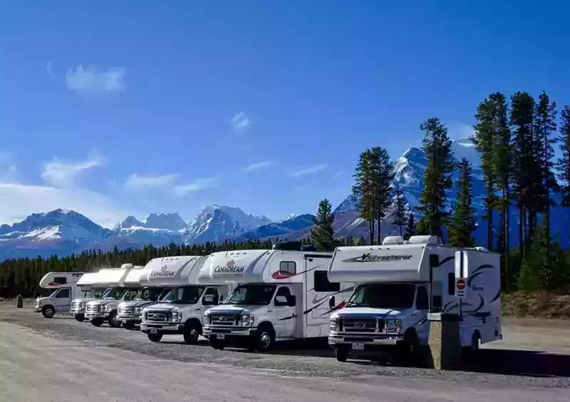 row of motorhomes in the mountains
