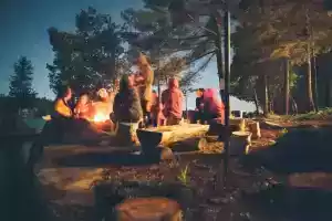 group around campfire at campground